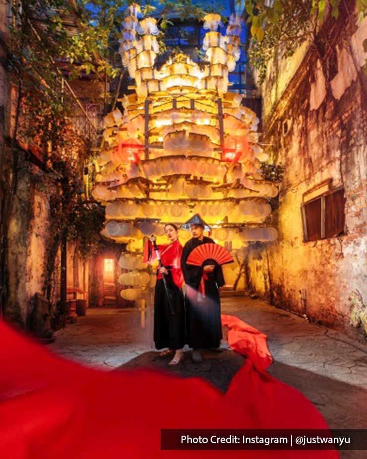 Couple wearing costumes posing in Kwai Chai Hong Street, a famous area near Imperial Lexis Kuala Lumpur