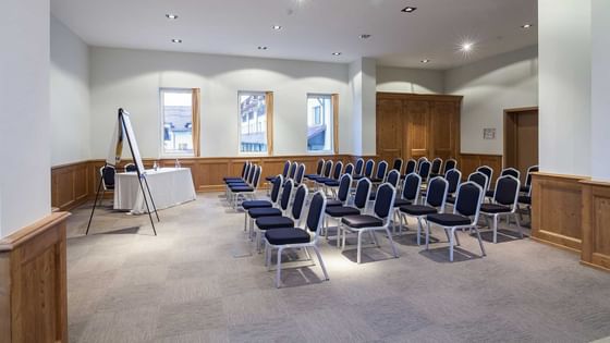 Meeting room with chairs arranged in rows at Ana Hotels Poiana