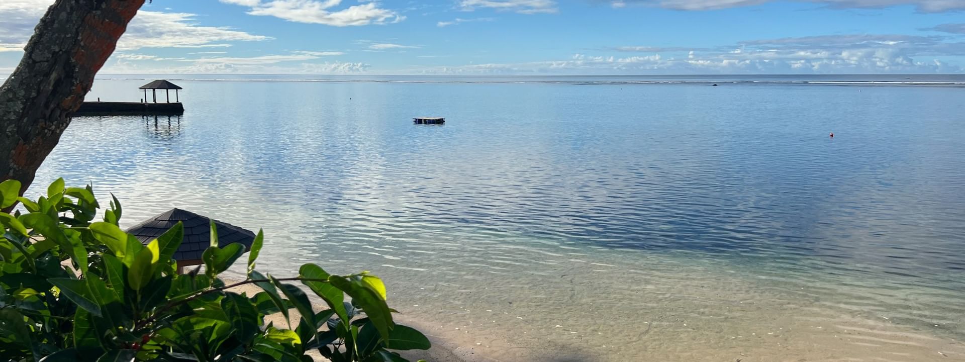 Sandy beach view with blue ocean and clear sky at Warwick Fiji Resort and Spa, Korolevu