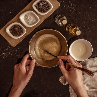 Mixing ingredients for a spa pack at Falkensteiner Family Resort Lido