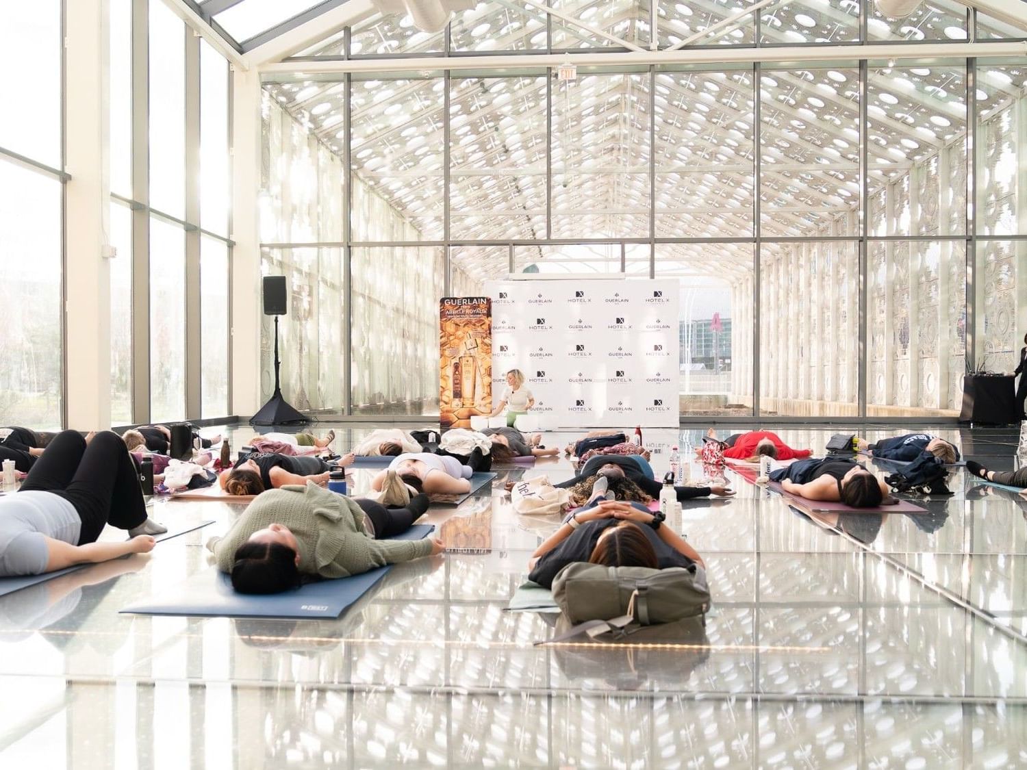 Singing and sound bath meditation class as part of the wellness event in New Fort Hall at Hotel X