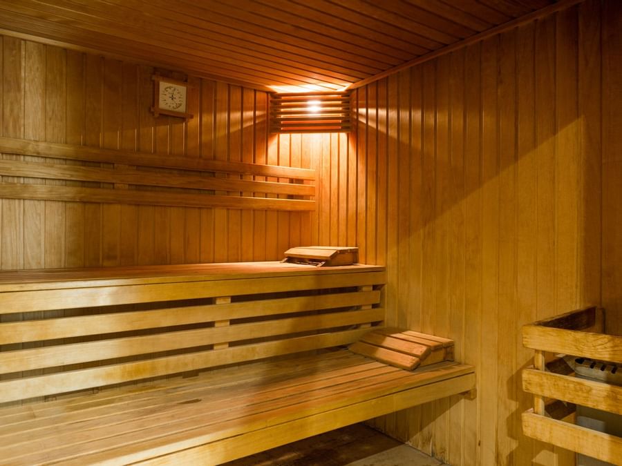 Interior of a spa room with wooden at Hotel Aux Vieux Remparts