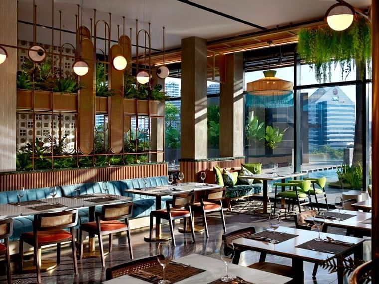 Dining area in Verandah Rooftop Rotisserie at Momentus Hotel Alexandra