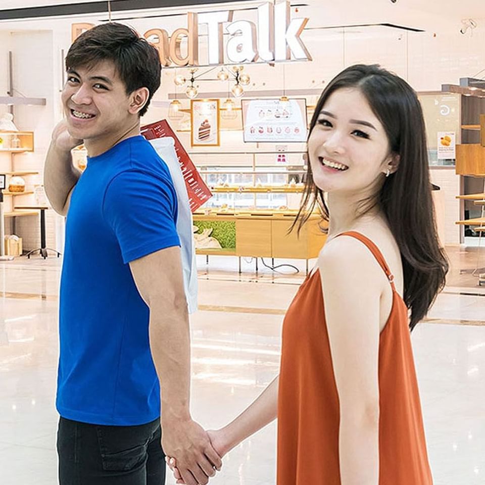 Happy couple posing inside Chadstone Mall near LK Cikarang Hotel & Residences