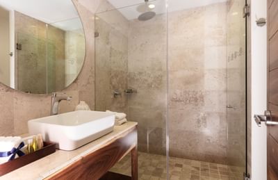 Interior of bathroom with mirror, shower and sink in Family Deluxe Room at Buenaventura Grand Hotel and Spa