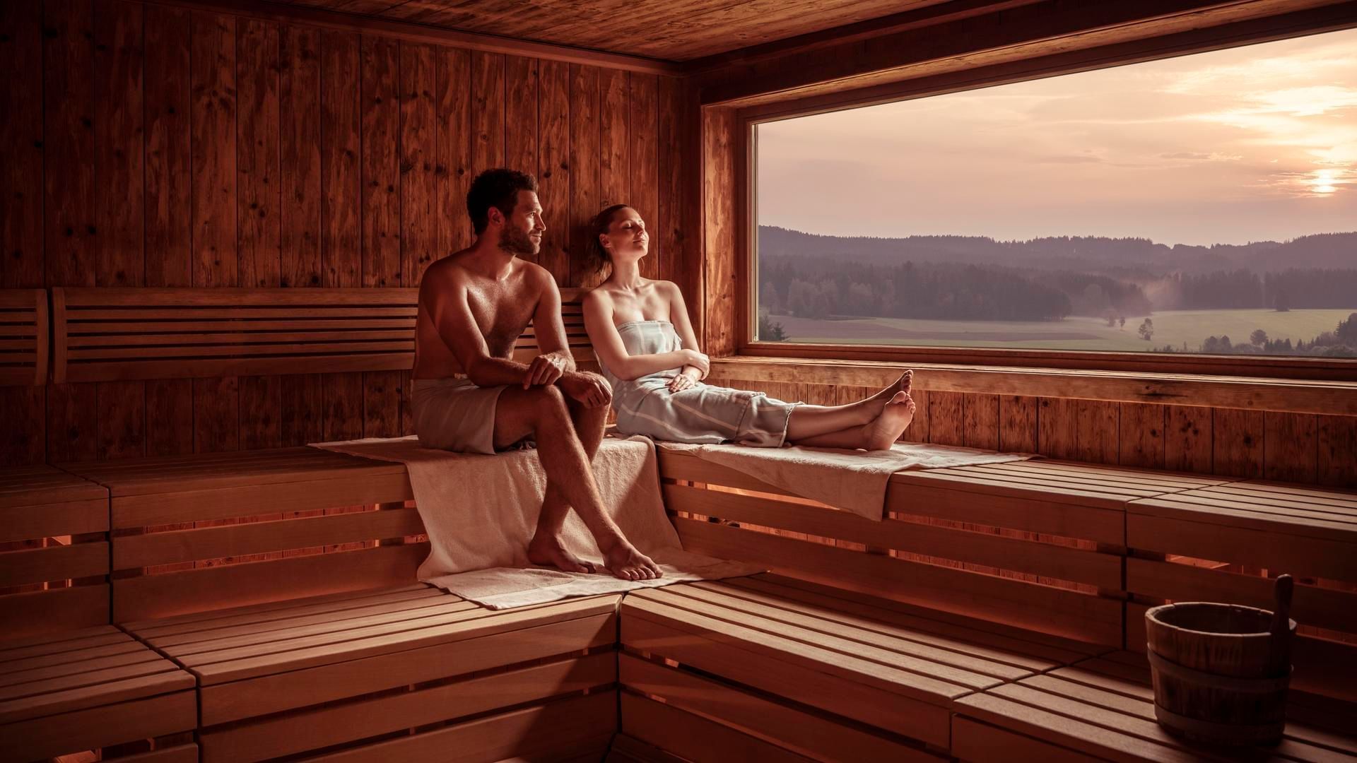 A couple relaxing in the sauna at Falkensteiner Genuss & Wohlfühlhotel Mühlviertel