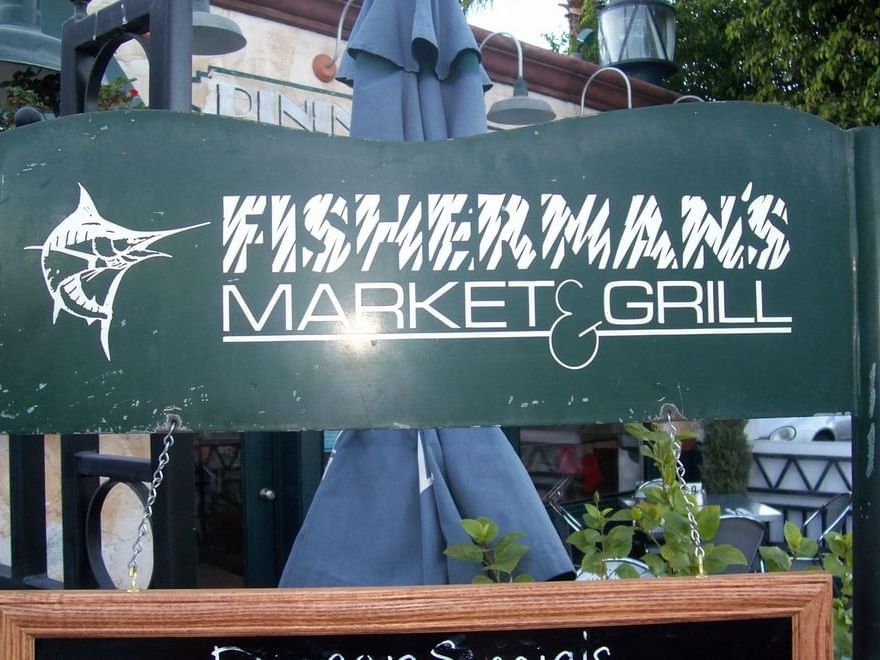 Entrance sign of Fisherman's Market at 7 Spring Inn & Suite