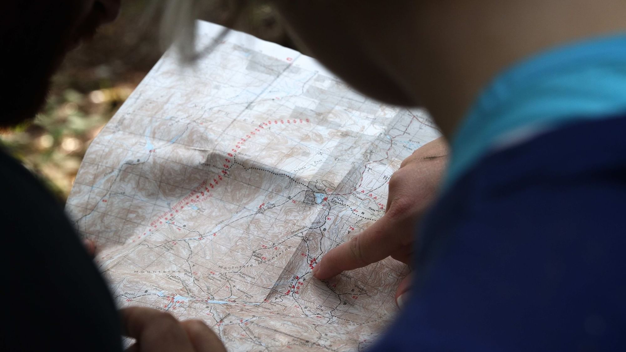 Closeup of a traveler reading a map at The Originals Hotels