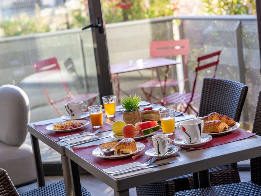 Breakfast served in Hotel Les Domes at The Originals Hotels