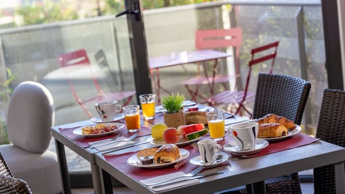 Breakfast served in Hotel Les Domes at The Originals Hotels