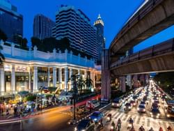 Exterior of Erawan Shrine in night near Chatrium Grand Bangkok