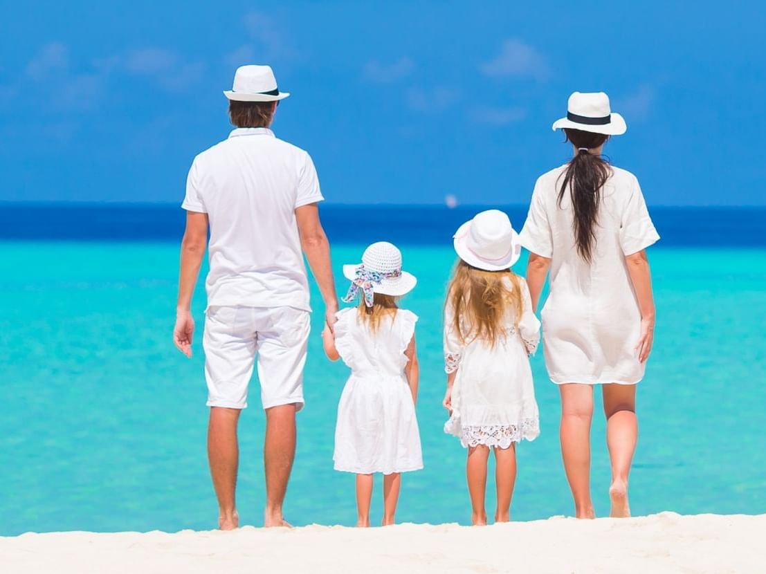 Family watching the ocean from shore at Daydream Island Resort