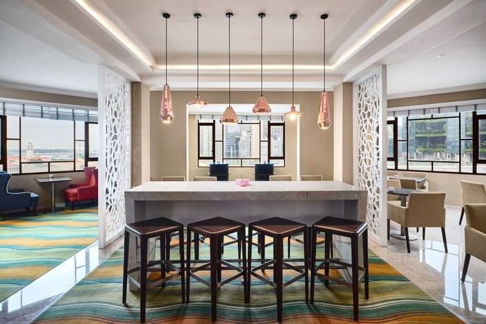 Modern kitchen with bar and stools at Paradox Singapore