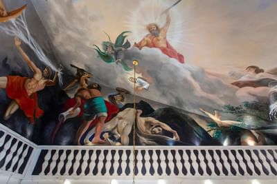 Vibrant mural depicting mythological figures in Terrazza of the Titans at The Roxbury