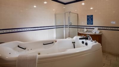 whirlpool tub and shower in spa room
