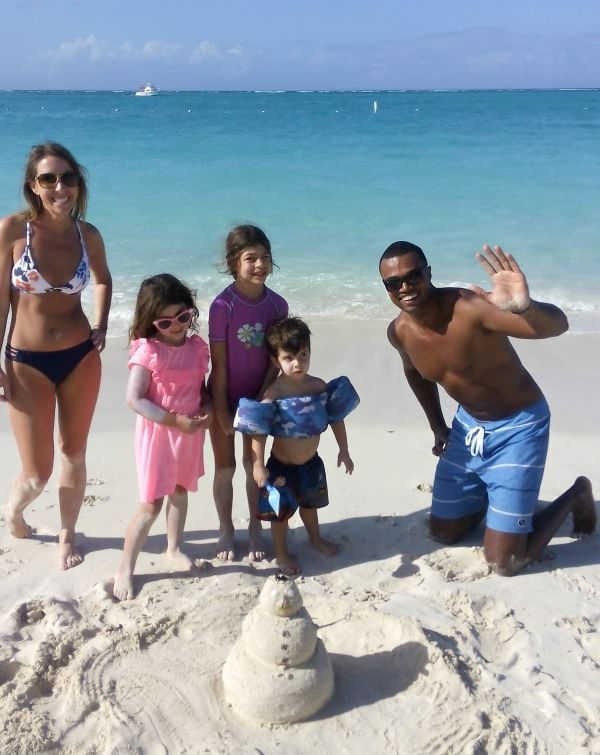 Family enjoying on the beach near The Somerset On Grace Bay