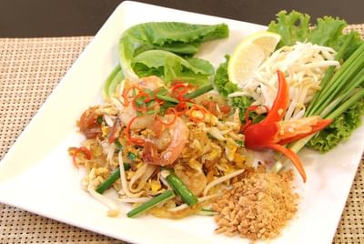 Seafood dish, salad leaves, fresh bell peppers at Amora Hotel