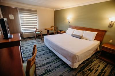King bed and work desk in Standard room at Araiza Hotel Calafia