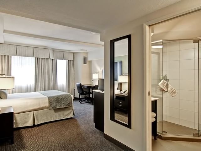 Bathroom and bed in hotel room