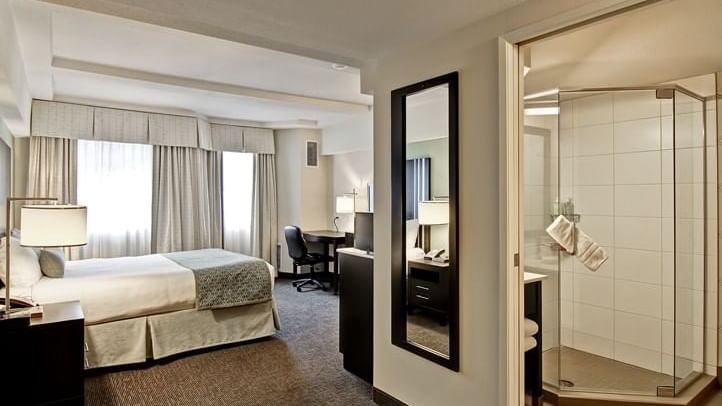 Bathroom and bed in hotel room