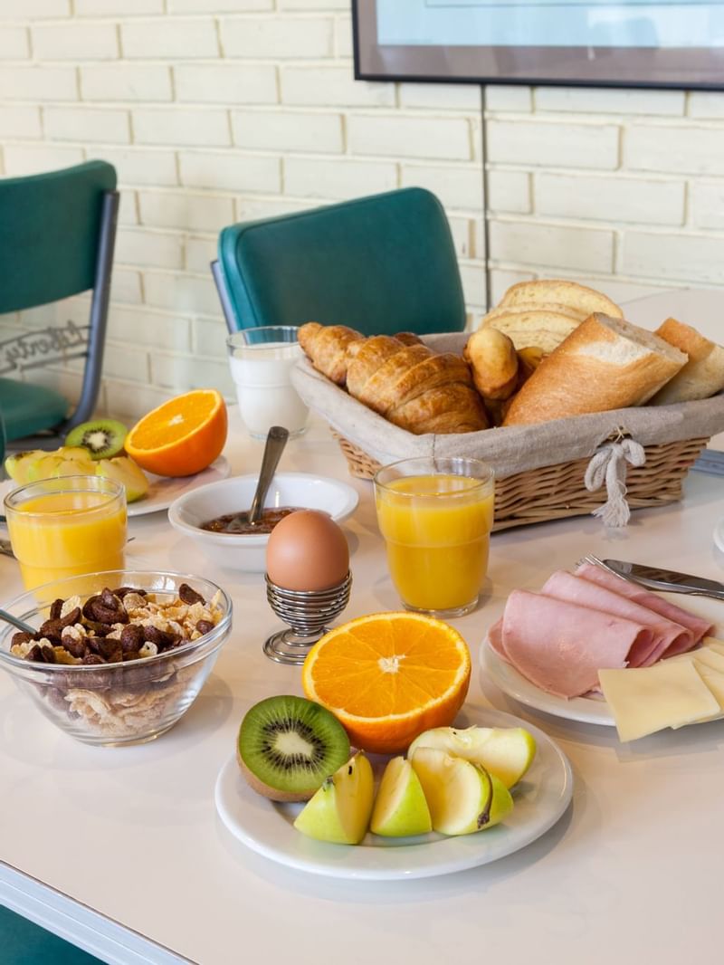 Fruits, cereal, meats & drinks at The Originals Hotels