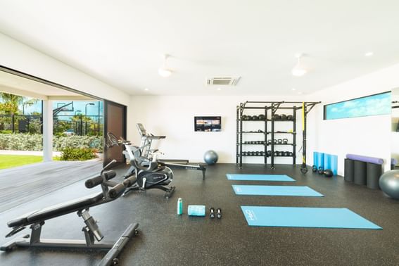 Exercise machines & yoga mats in the gym, H2O Life Style Resort