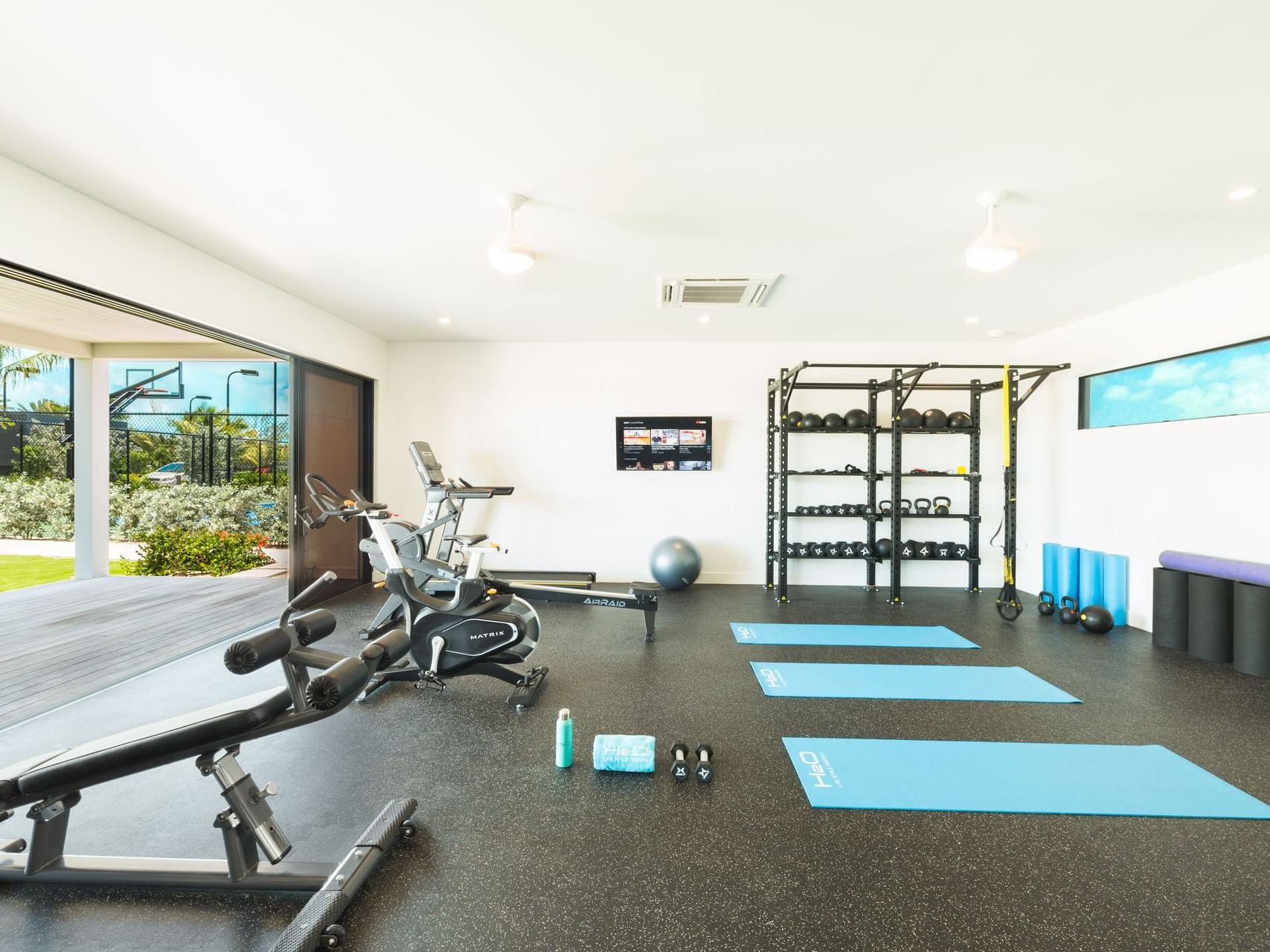 Exercise machines & yoga mats in the gym, H2O Life Style Resort