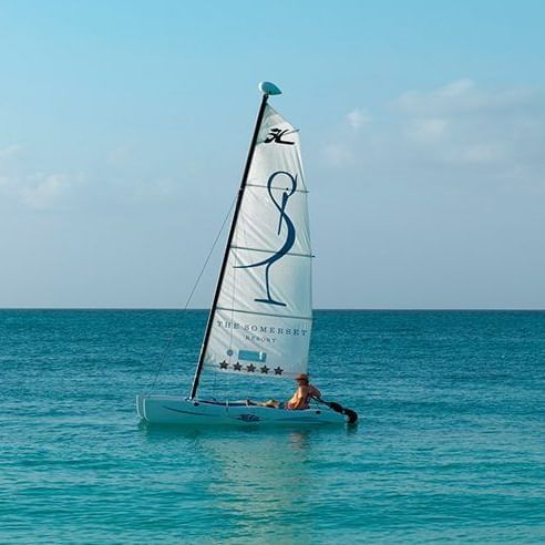 Man sailing on a boat of The Somerset On Grace Bay at the beach