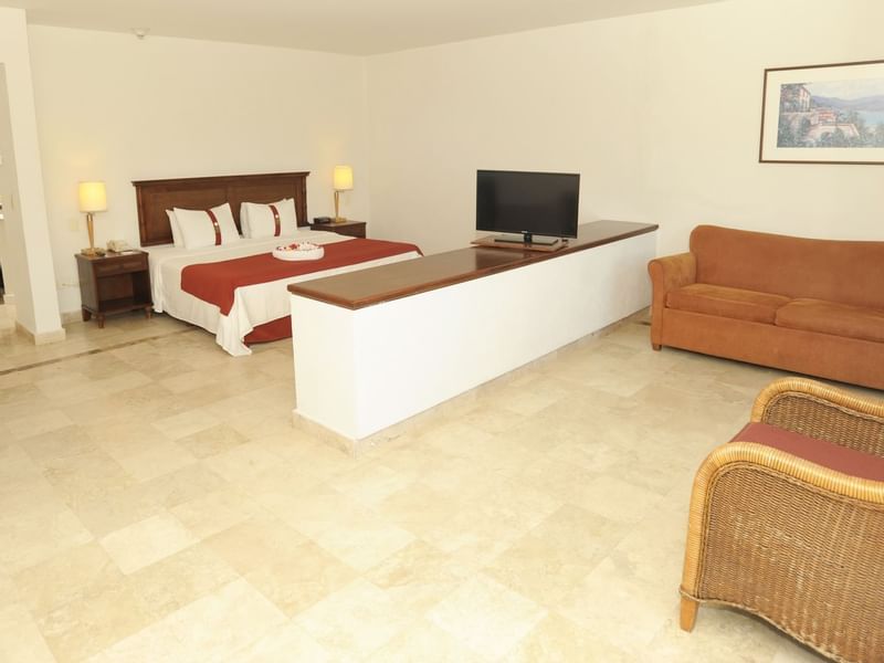 Master Suite with King bed & sofa at Gamma Hotels