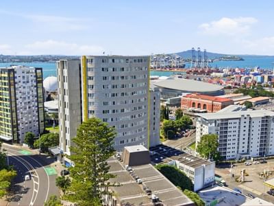 Aerial view of urban skyline and waterfront at Student Living Auckland - Beach.