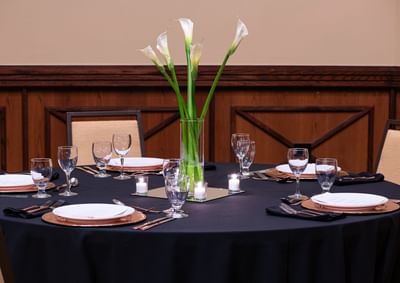Banquet table with lilies at NCED Hotel and Conference Center