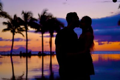 Couple kissing on sea shore, The Morgan Resort Spa Village