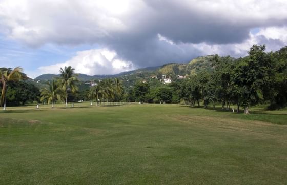 A picturesque golf course of Constant Spring Golf Club at Courtleigh Hotel & Suites