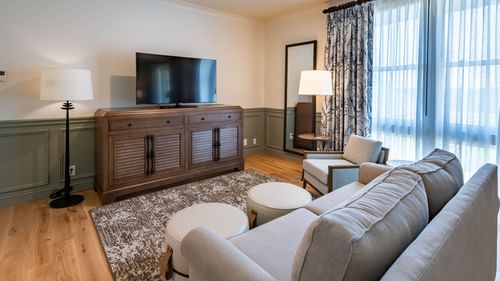 TV stand & comfy lounge area in Junior Golf Suite at Camp Creek Inn