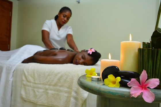 Lady receiving a hot stone massage in the Spa at Holiday Inn Montego Bay