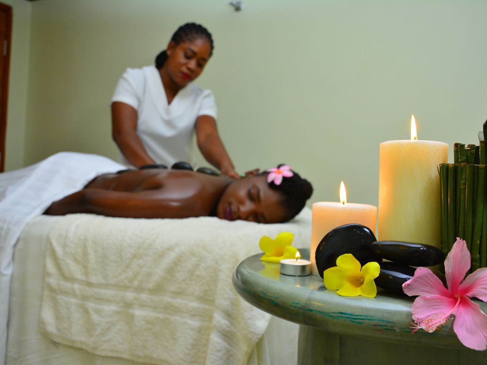 A lady receiving a hot stone massage at Holiday Inn Montego Bay