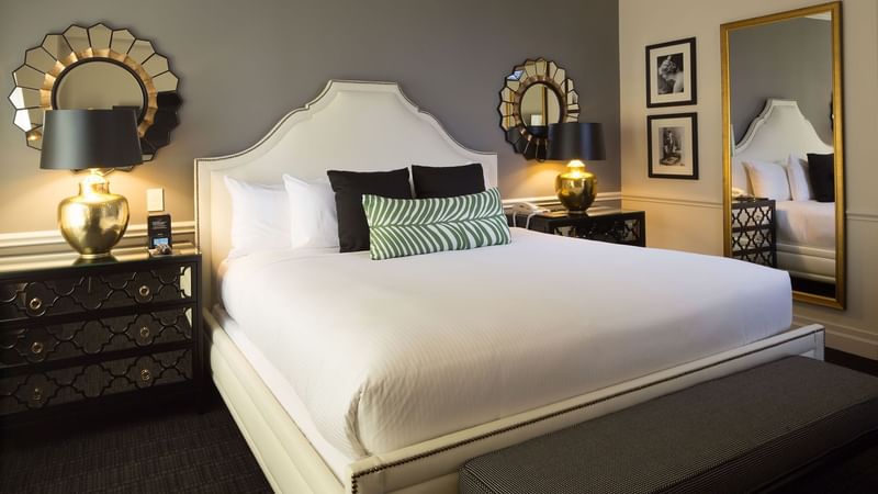 Comfy bed and side tables in Marion Suite at Warwick New York