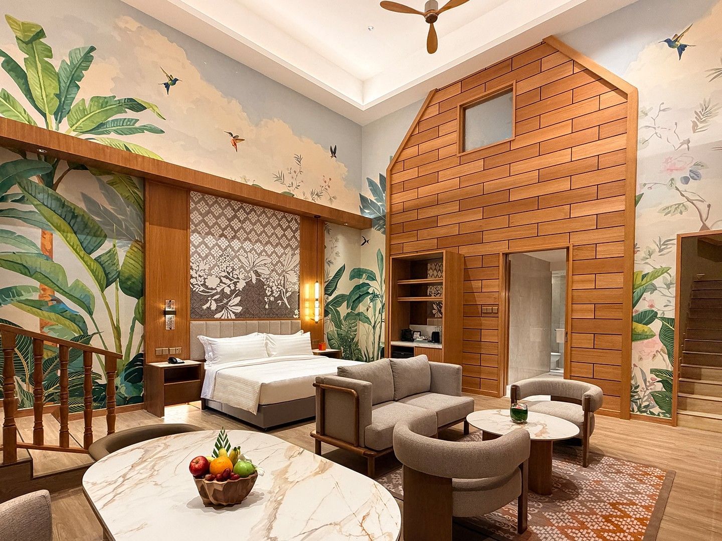 Spacious Pelangi Duplex Suite with high ceilings, tropical murals, and modern furnishings at Pelangi Beach Resort & Spa, Langkawi