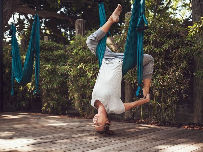 A woman practicing yoga at Marbella Club Hotel