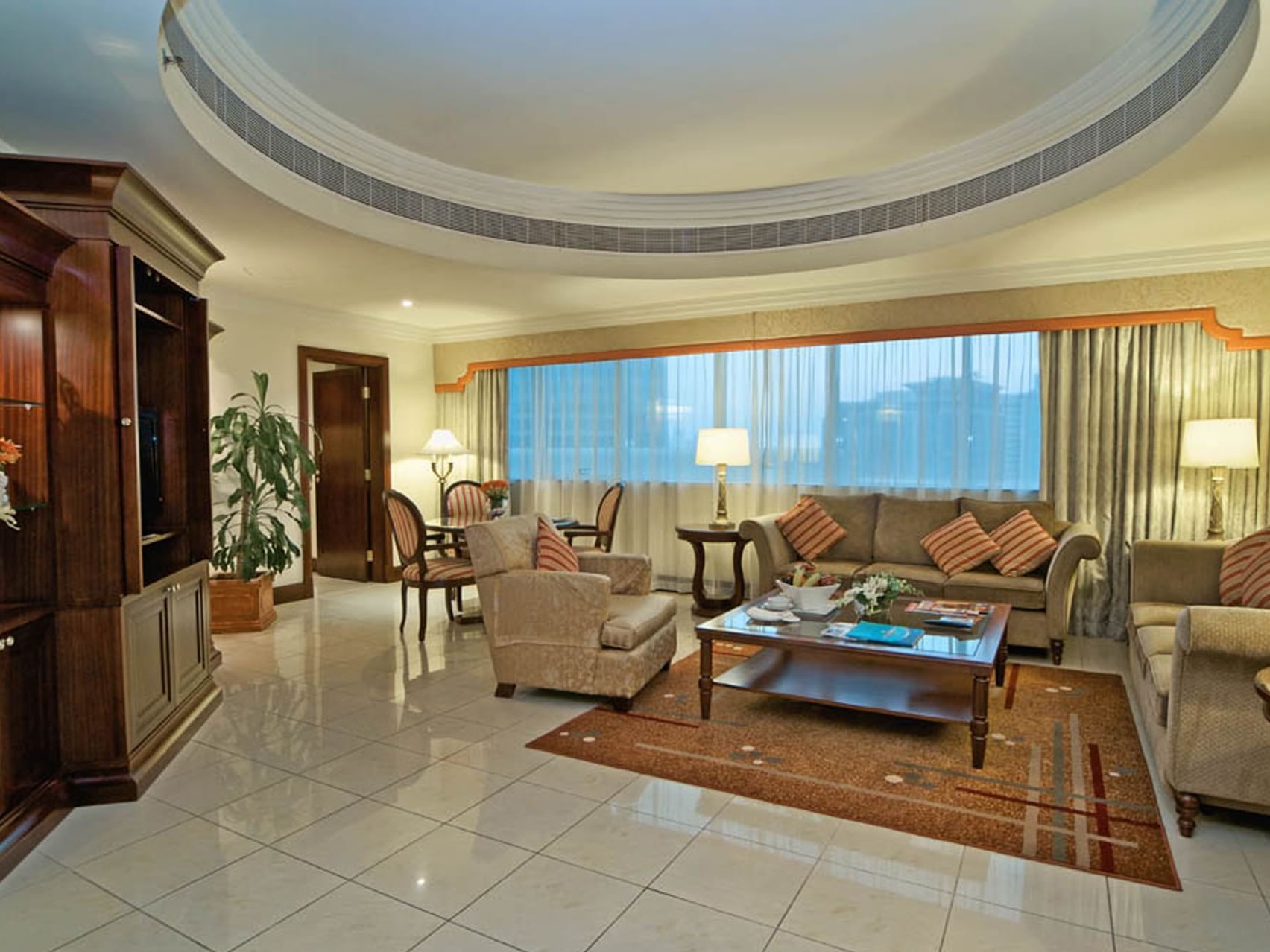 Living area in Deluxe One Bedroom Suites at City Season Hotels