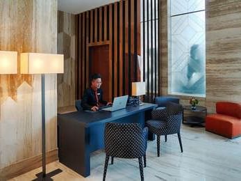 reception desk in lobby area with cushion seating