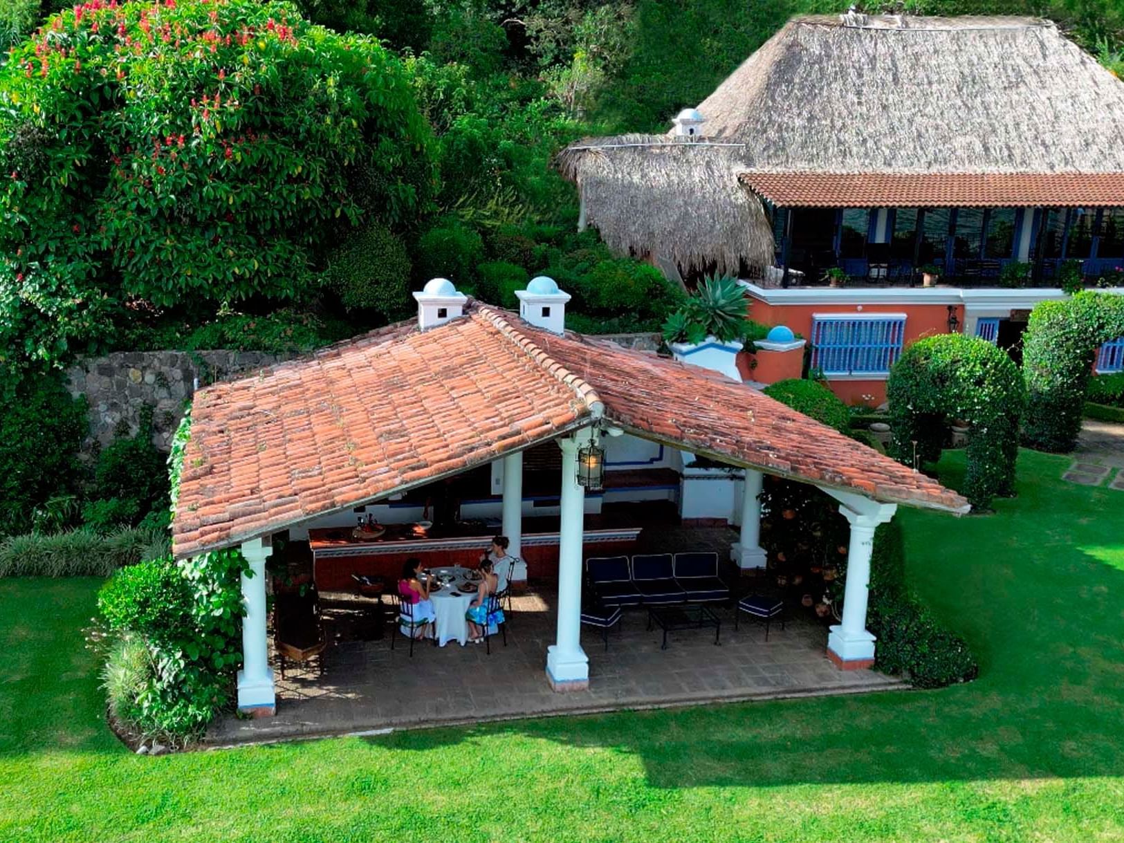 Distant view of ladies dining in Ranchito at Hotel Atitlan