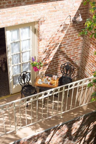 Guest room balcony with a lounge at Horton Grand Hotel