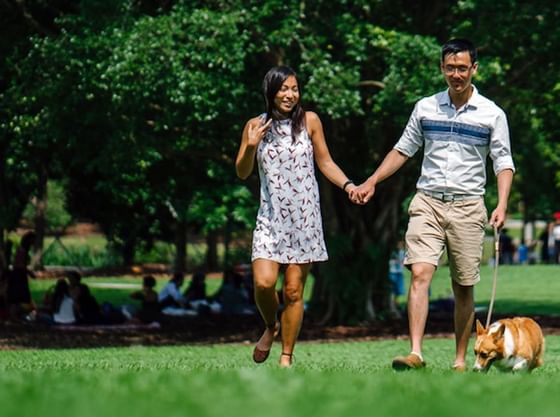 Couple walking with their dog near Richmond Hill Hotel