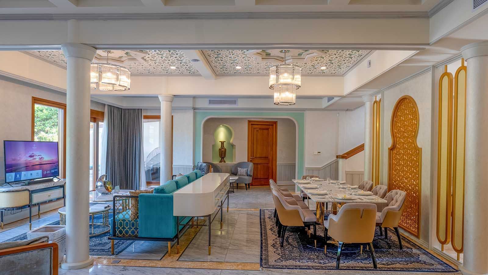 Dining & living area in a room at The Signature Collection