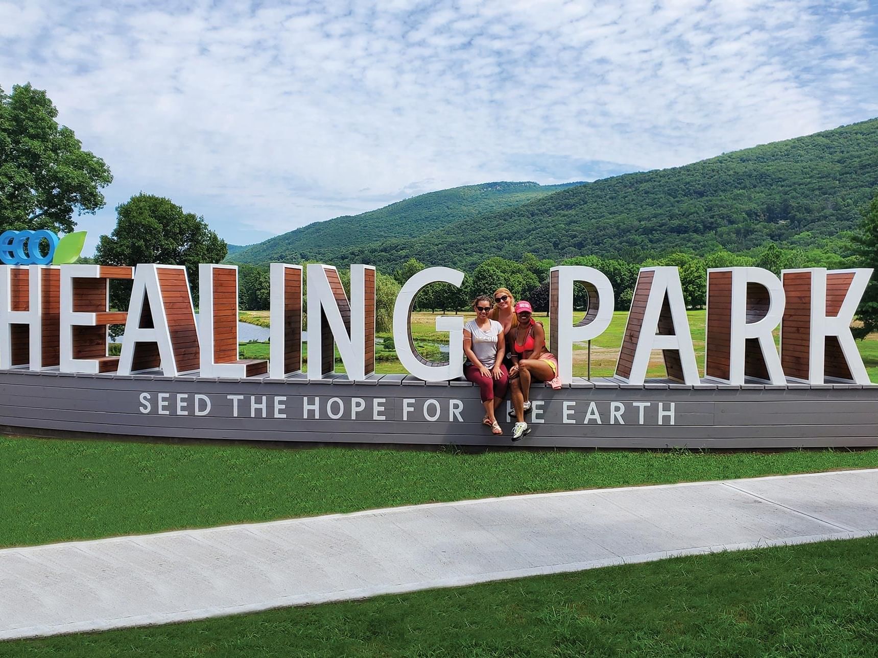 3 women at the ECO healing park entrance near Honor’s Haven