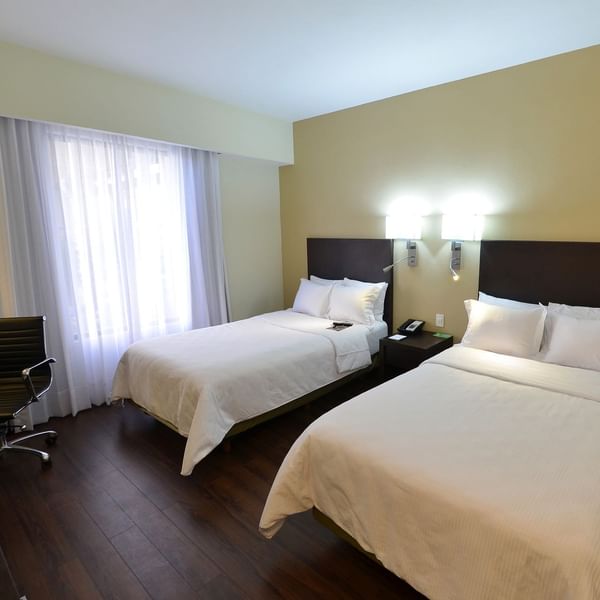 Twin beds in Superior Room at Fiesta Inn