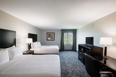 TV stand facing the beds in Standard Two Doubles Non-Smoking at Garden Executive Hotel, one of the best places to stay in NJ