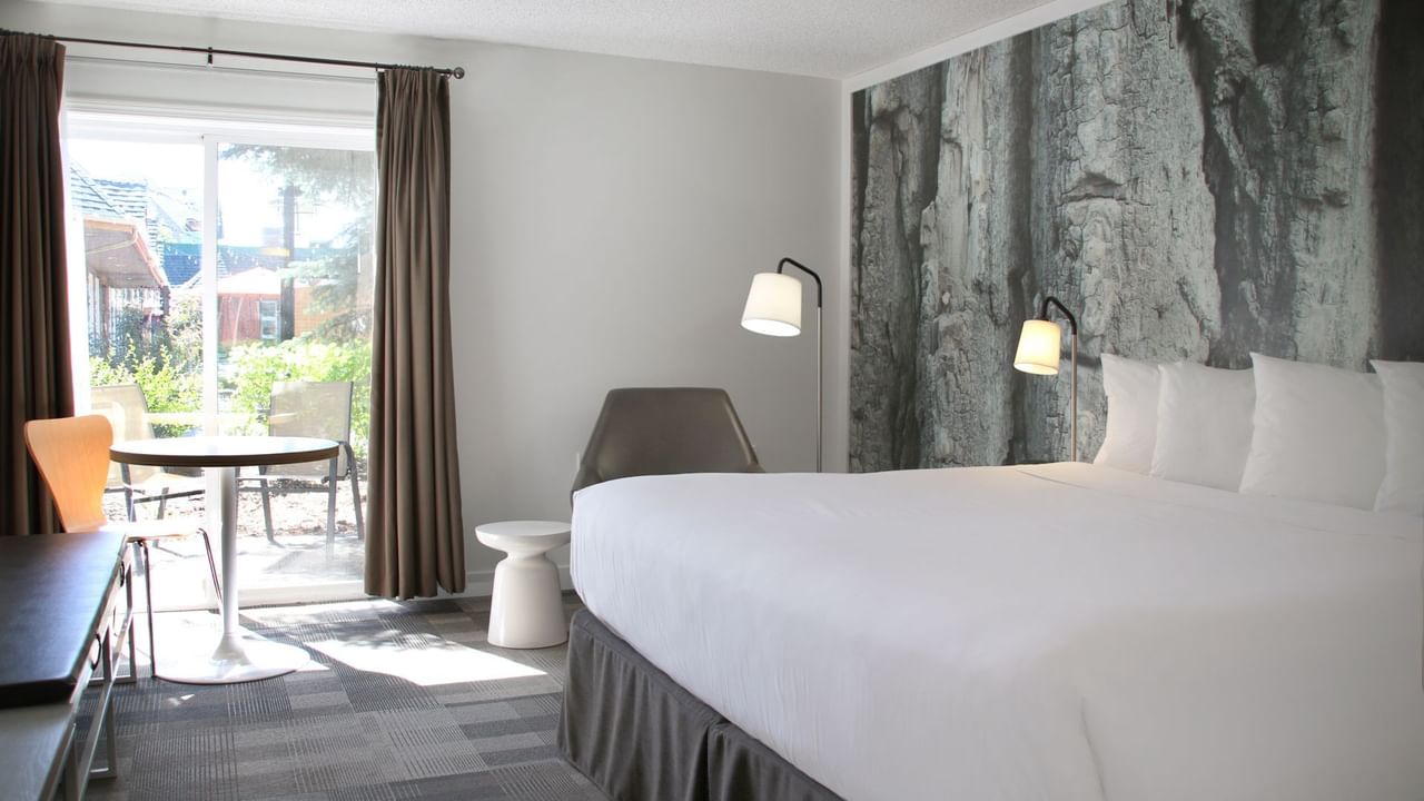 Bed in hotel room with access to outside