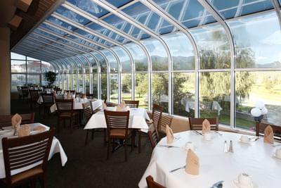 Dining table arranged in the Dapper's Landing at Fairmont Hot Springs Resort